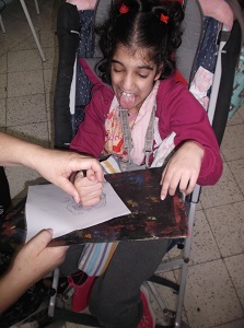 Enforcing the grip - Luana using coloured pencils for her handout.
