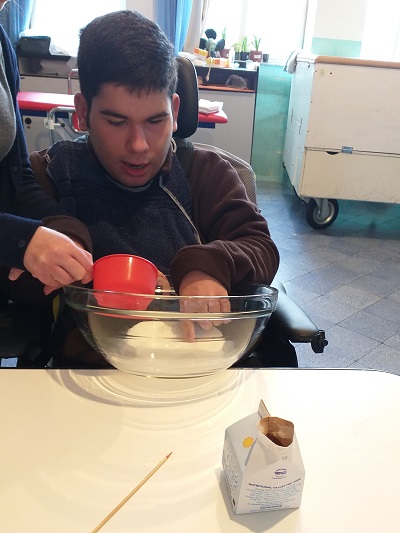 Manuel pouring the milk into a bowl.
